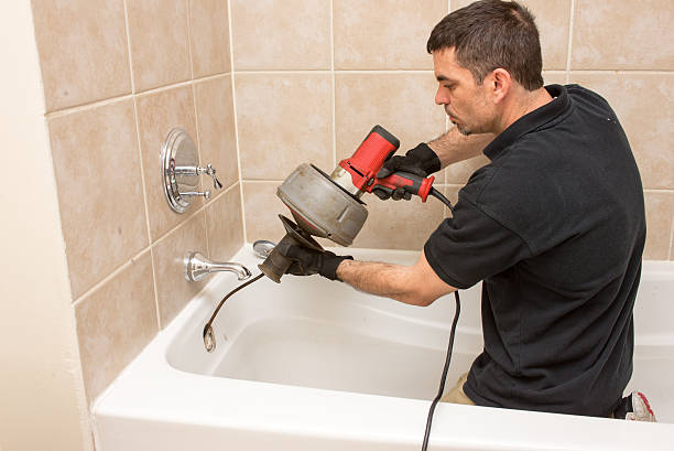 Broomfield emergency plumber clearing clogged drain
