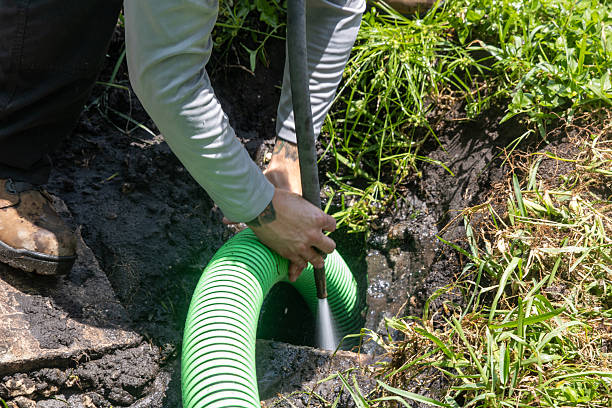 Plumber clearing a clogged kitchen drain in Brighton, Colorado